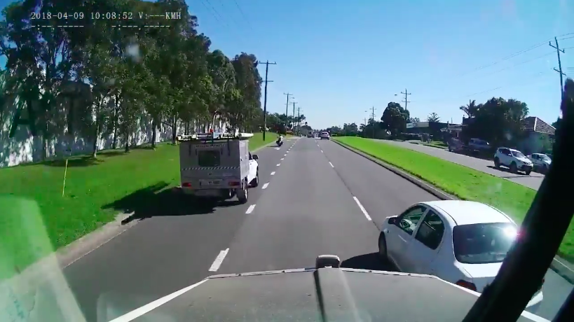 The white car tries to change lanes but doesn't see the truck. Photo: Facebook/ash Cam Owners Australia