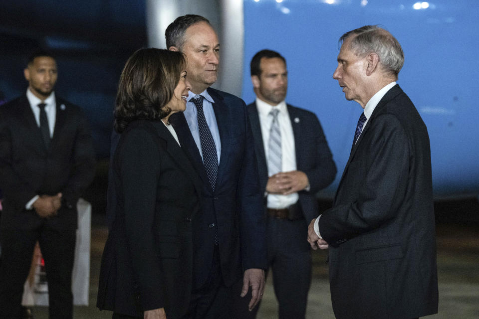 Vice President Kamala Harris and her husband Doug Emhoff are greeted by Robert Godec, U.S. Ambassador to Thailand, upon arrival at Don Mueang International Airport in Bangkok, Thailand on Thursday, Nov. 17, 2022, to attend the Asia-Pacific Economic Cooperation (APEC) summit. (Haiyun Jiang/The New York Times via AP, Pool)