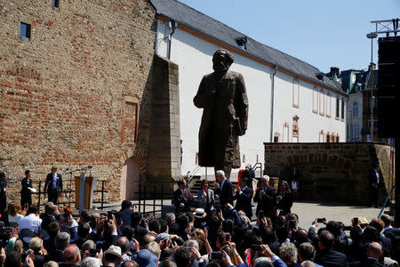 The 4.4 metres (14 feet) high bronze statue of Karl Marx, created by Chinese artist Wu Weishan and donated by China to mark the 200th birth anniversary of the German philosopher, is seen in his hometown Trier, Germany May 5, 2018. REUTERS/Wolfgang Rattay