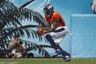 Denver Broncos wide receiver Tim Patrick makes a reception on his way to a touchdown on a 12-yard play against the Jacksonville Jaguars during the first half of an NFL football game, Sunday, Sept. 19, 2021, in Jacksonville, Fla. (AP Photo/Stephen B. Morton)