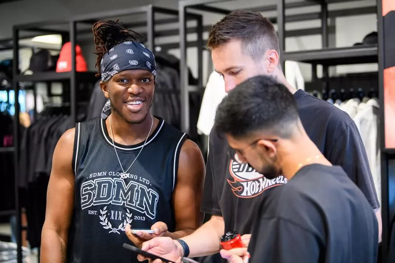 KSI, Simon Minter and Vikram Singh Barn are seen at a surprise visit as YouTube collective 'Sidemen' open their first retail store at Bluewater Shopping Centre on July 15, 2023