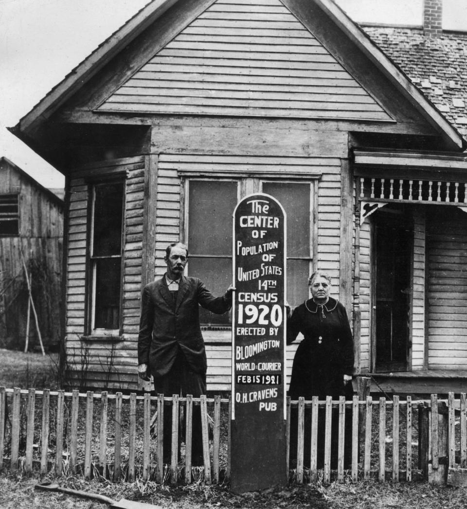 <p>An Indiana couple, Mr. and Mrs. John Herrin, pose outside their farmhouse in Bloomington, Indiana. Their home was declared "the center of the population," according to the 1920 U.S. census.</p>