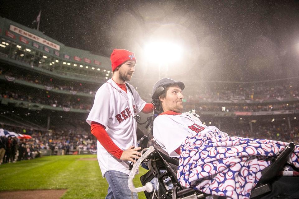 Pete Frates is introduced before a Boston Red Sox game in a packed stadium. 