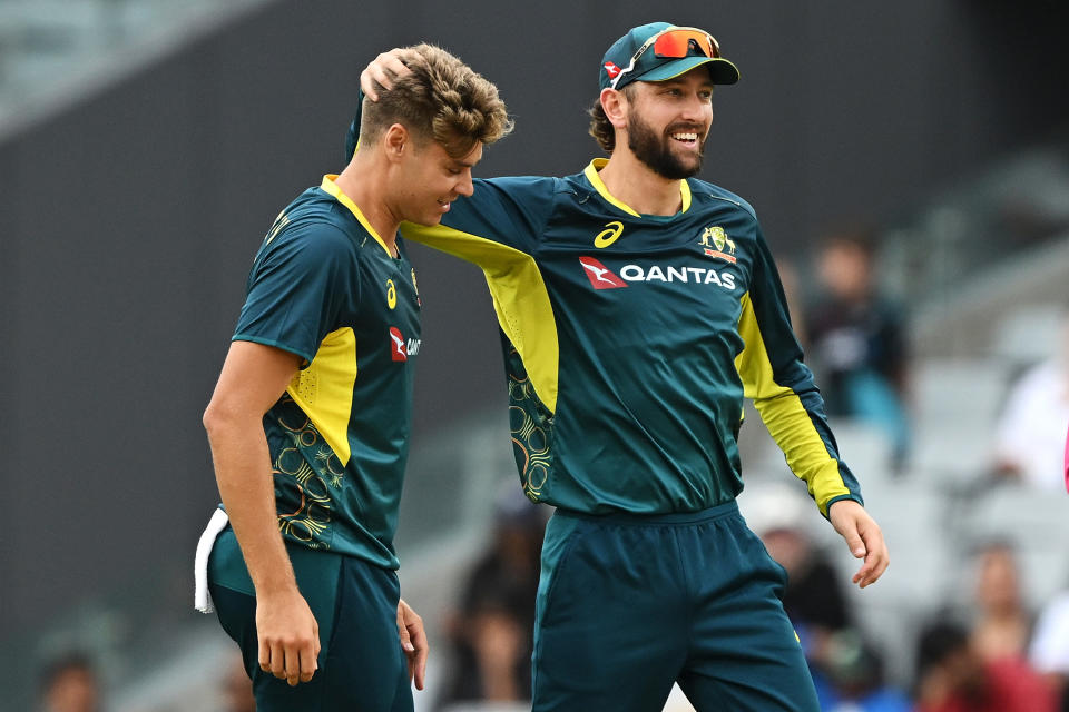 AUCKLAND, NEW ZEALAND - FEBRUARY 25: Spencer Johnson and Matt Short of Australia celebrate Spencer Johnson taking the wicket of Tim Seifert of New Zealand during game three of the Men's T20 International series between New Zealand and Australia at Eden Park on February 25, 2024 in Auckland, New Zealand. (Photo by Hannah Peters/Getty Images)