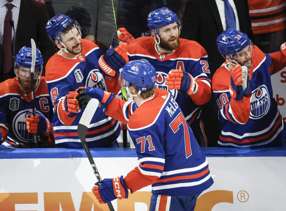 Edmonton Oilers' Ryan McLeod (71) is congratulated for a goal against the Florida Panthers during the third period of Game 4 of the NHL hockey Stanley Cup Final, Saturday, June 15, 2024, in Edmonton, Alberta. (Jeff McIntosh/The Canadian Press via AP)