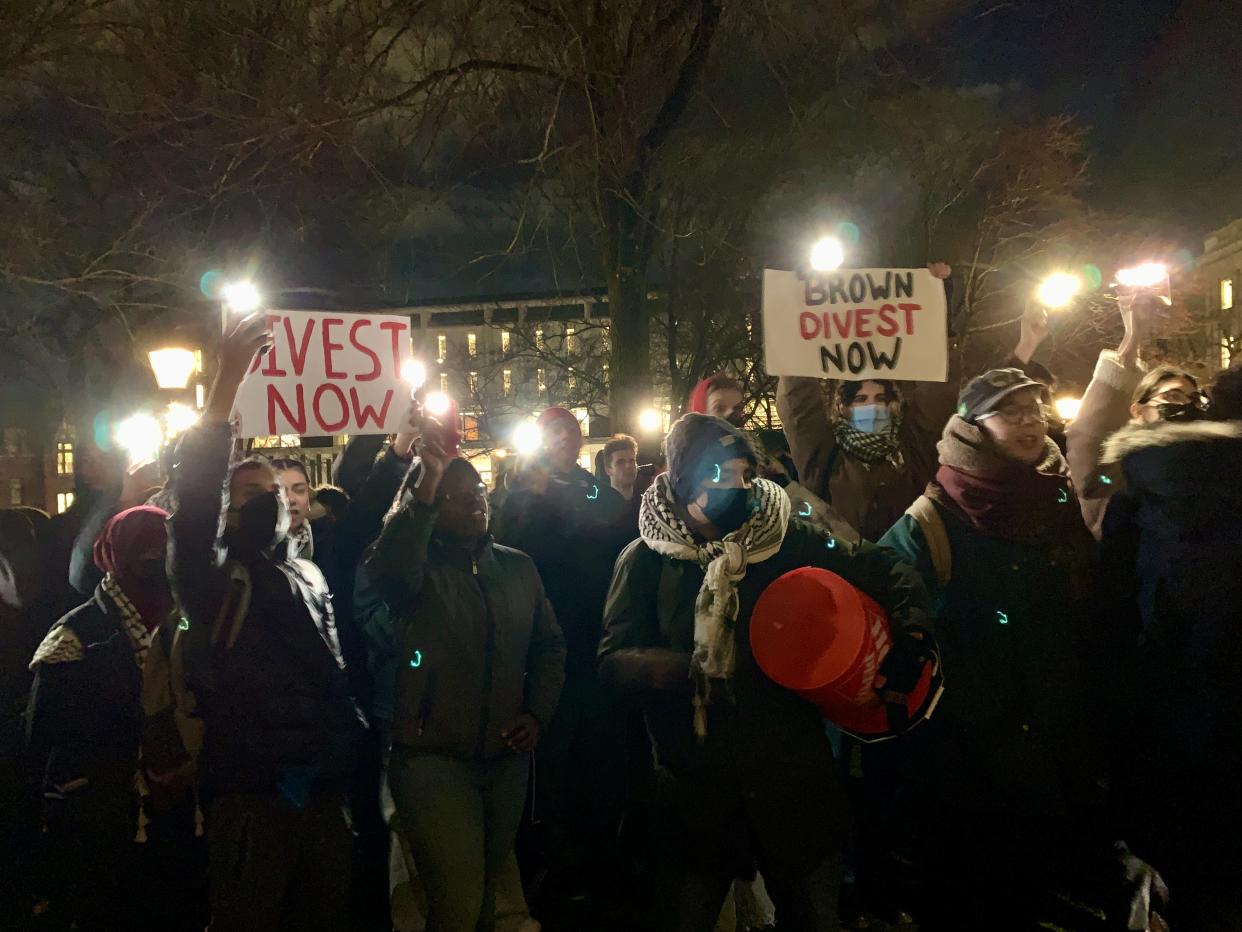 More than 200 Brown University students gathered outside University Hall while roughly 40 students sat inside, all of them demanding that the school divest from weapons manufacturers amid the Israel-Hamas war.