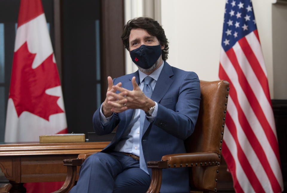 Canadian Prime Minister Justin Trudeau is seen as he speaks virtually with United States President Joe Biden from his office on Parliament Hill in Ottawa, Ontario, Tuesday, Feb. 23, 2021. (Adrian Wyld/The Canadian Press via AP)