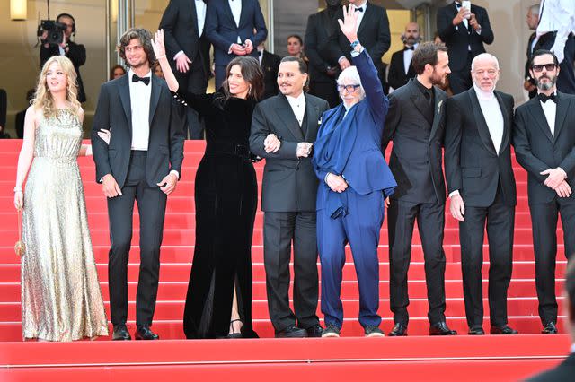 Stephane Cardinale - Corbis/Corbis via Getty Johnny Depp with <em>Jeanne du Barry</em> cast