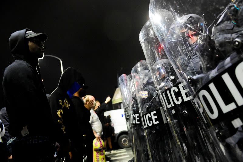 Demonstrators clash with riot police during a rally after the death of Walter Wallace Jr., a Black man who was shot by police, in Philadelphia