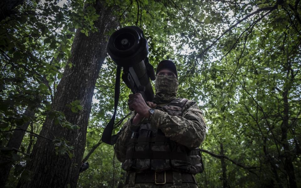 A Ukrainian serviceman keeps watch near the frontlines of Izium, south of Kharkiv, Ukraine, on 8 June 2022.  - Maria Senovilla/Shutterstock