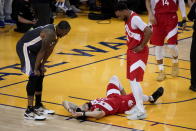 Toronto Raptors guard Fred VanVleet #23 remains on the floor as he is checked on by forward #24 and Golden State Warriors forward Andre Iguodala #9 during the second half of Game 4 of basketball's NBA Finals in Oakland, California, Friday, June 7, 2019. (Photo by AP Photo/Tony Avelar)