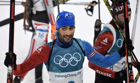 Biathlon - Pyeongchang 2018 Winter Olympics - Men's 15 km Mass Start Final - Alpensia Biathlon Centre - Pyeongchang, South Korea - February 18, 2018 - Martin Fourcade of France reacts. REUTERS/Toby Melville