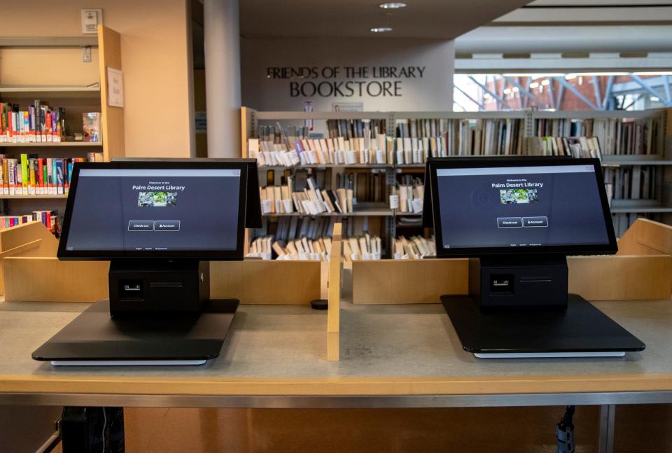 Self-service checkout stations are seen at the Palm Desert branch library in Palm Desert, Calif., Saturday, June 24, 2023. 
