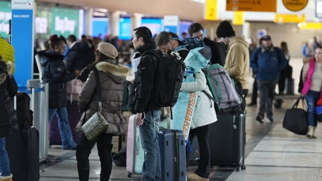 Travelers at Denver International Airport.