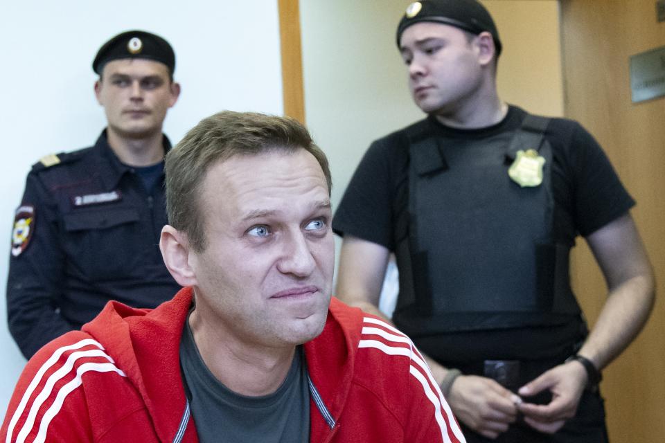 Russian leader Alexei Navalny speaks to the media prior to a court session in Moscow, Russia, Thursday, Aug. 22, 2019. Navalny is due in court, where a judge will consider extending his detention in lieu of days spent in hospital, where he was being treated for an allergic attack at the end of July. Navalny was due to be released on Friday after serving 30 days for calling an unsanctioned protest. (AP Photo/Alexander Zemlianichenko)