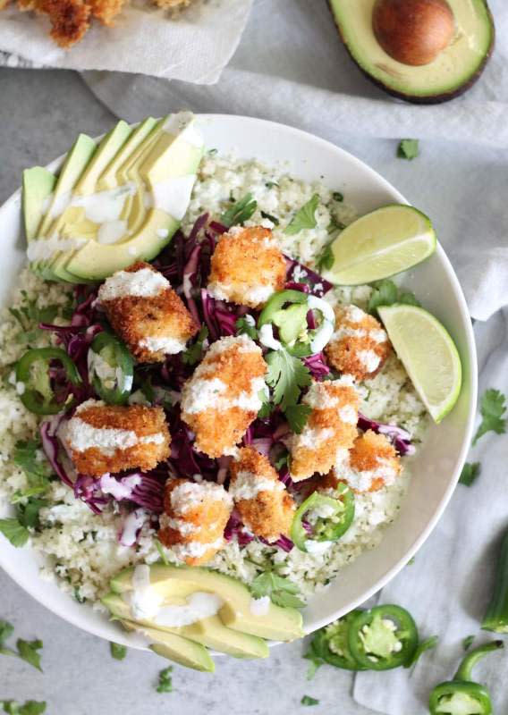 <p>Spices in My DNA</p><p>These crispy fish taco cauliflower rice bowls are lightened up with cilantro lime cauliflower rice, panko-crusted cod and a super delicious lime crema!</p><p><strong>Get the recipe: <a href="https://www.spicesinmydna.com/crispy-fish-taco-cauliflower-rice-bowls/" rel="nofollow noopener" target="_blank" data-ylk="slk:Crispy Fish Taco Cauliflower Rice Bowls;elm:context_link;itc:0;sec:content-canvas" class="link rapid-noclick-resp">Crispy Fish Taco Cauliflower Rice Bowls</a></strong></p>