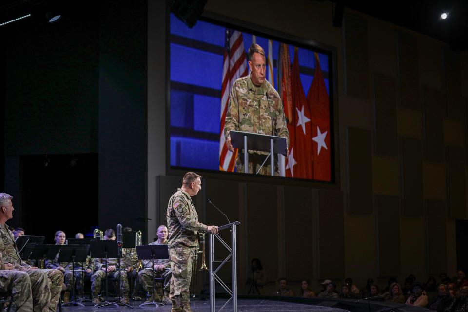 135th Expeditionary Sustainment Commanding General and Alabama National Guard Brigadier General Thomas Vickers is seen on stage and on screen addressing his soldiers during their post-deployment welcome home ceremony in Birmingham, Ala., January 14, 2023. The emotional speech crowned a long awaited return home by soldiers from the 135th ESC and their families.