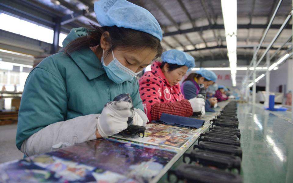 An assembly line producing speakers at a factory in Fuyang city in China - STR/AFP via Getty Images