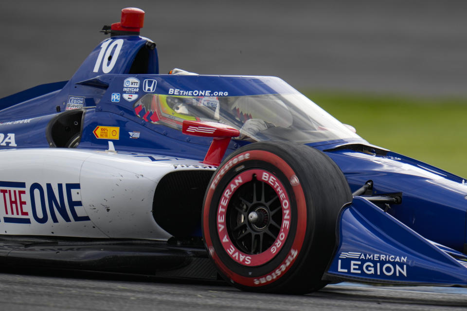 Alex Palou, of Spain, drives through a turn during the IndyCar auto race at Indianapolis Motor Speedway in Indianapolis, Saturday, May 13, 2023. (AP Photo/Michael Conroy)