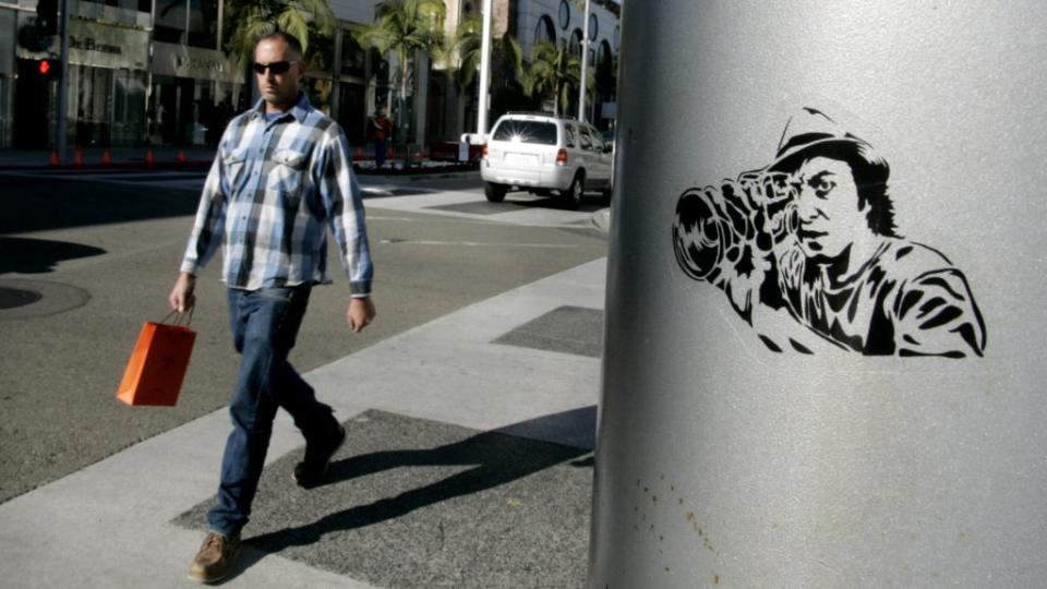 Shopper walks on Rodeo Drive in Beverly Hills, California