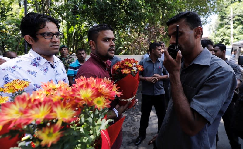 Supporters of Sri Lanka People's Front party presidential election candidate and former wartime defence chief Gotabaya Rajapaksa gather in front of his residence to wish him well after he won the presidential election in Colombo