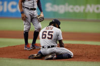 Detroit Tigers pitcher Gregory Soto kneels on the field after getting hit by the ball during the ninth inning of a baseball game against the Tampa Bay Rays Friday, Sept. 17, 2021, in St. Petersburg, Fla. (AP Photo/Scott Audette)