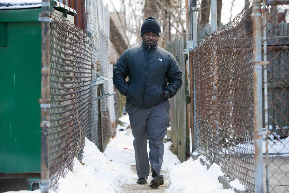 H.B. du Pont Middle School Assistant Principal Terrance D. Newton walks down the Wilmington alley near where he was shot as a teen. His friend, Jamar Kilgoe, was killed Monday at the Rose Hill Community Center. “We’re losing people to the streets,” Newton says.