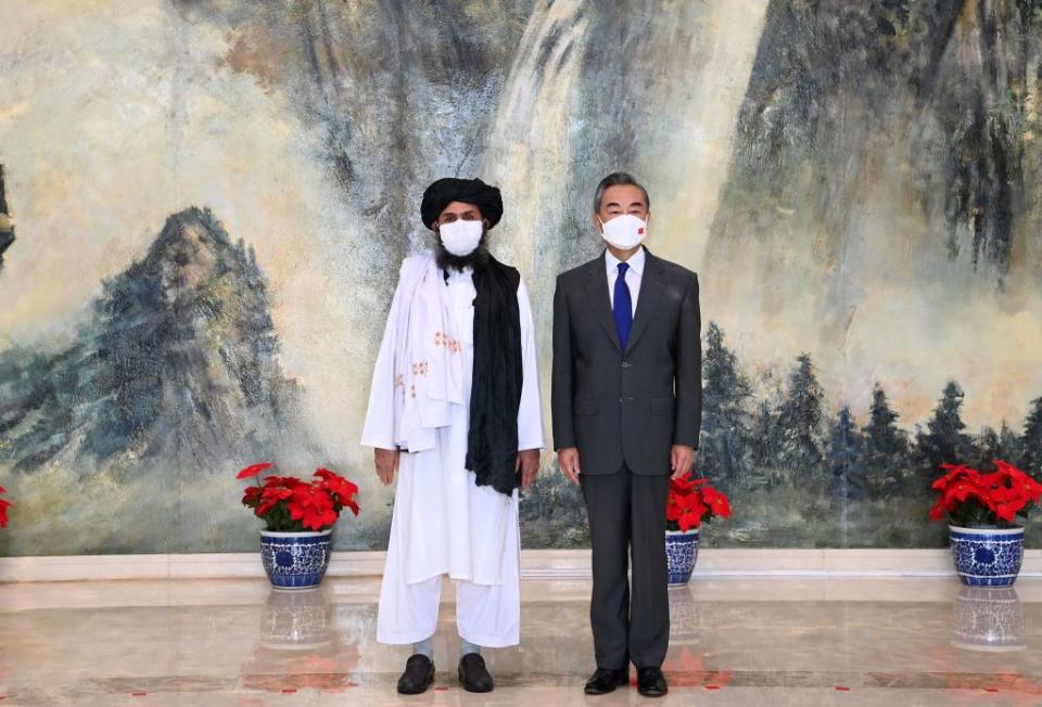 Chinese State Councilor and Foreign Minister Wang Yi meets with Mullah Abdul Ghani Baradar, political chief of Afghanistan's Taliban, in north China's Tianjin, July 28, 2021.<span class="copyright">Li Ran/Xinhua via Getty Images</span>