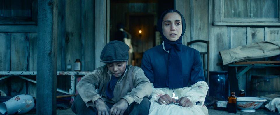Orphan Paolo (Federico Ielaip) and Mother Francesca Cabrini (Cristiana Dell’Anna) mourn the death of another orphan boy in the film, “Cabrini.”