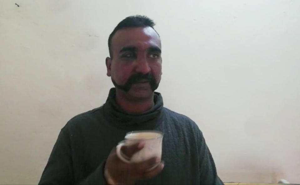 In this image taken from video released by Pakistan's military, showing what they claim to be an Indian pilot who was captured after his plane was shot down by Pakistan's Air Force in the country's part of Kashmir. Pakistan’s military said Wednesday it shot down two Indian warplanes in the disputed region of Kashmir and captured a pilot, answering an air strike a day earlier by Indian aircraft inside Pakistan. (Pakistan military via AP)