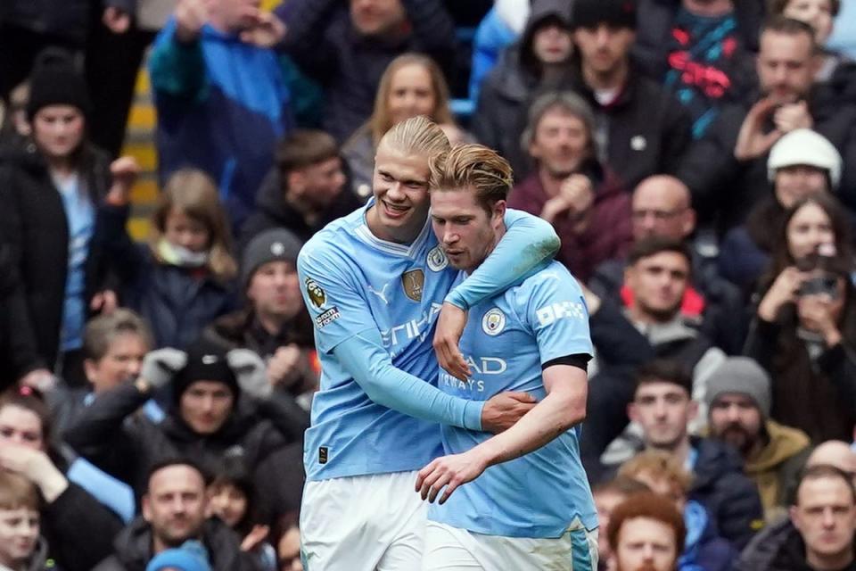 Erling Haaland, left, celebrates scoring his second goal with Kevin De Bruyne (Martin Rickett/PA) (PA Wire)