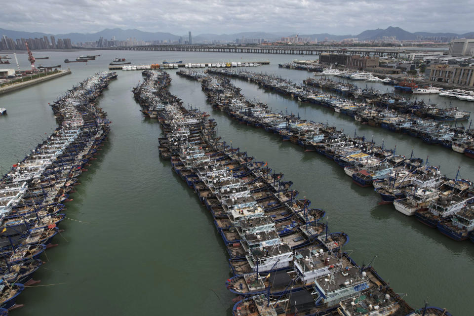 In this photo released by Xinhua News Agency, fishing boats taking shelter at a port as they preparing for the Typhoon Doksuri in Xiamen in southeast China's Fujian Province on July 26, 2023. The coastal Chinese city of Shantou on Thursday joined parts of Taiwan in shutting down schools and offices as Typhoon Doksuri brings heavy wind and rain to the Taiwan Strait and surrounding areas. ( Zeng Demeng/Xinhua via AP)