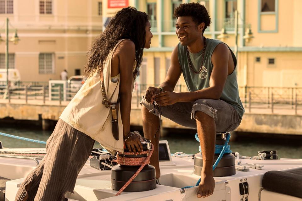 Outer Banks. (L to R) Carlacia Grant as Cleo, Jonathan Daviss as Pope in episode 302 of Outer Banks. Cr. Jackson Lee Davis/Netflix © 2022