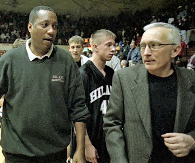 Coach Perry Reese and longtime assistant Dale Stutzman leave the floor at the Canton Fieldhouse after another regional tournament win.