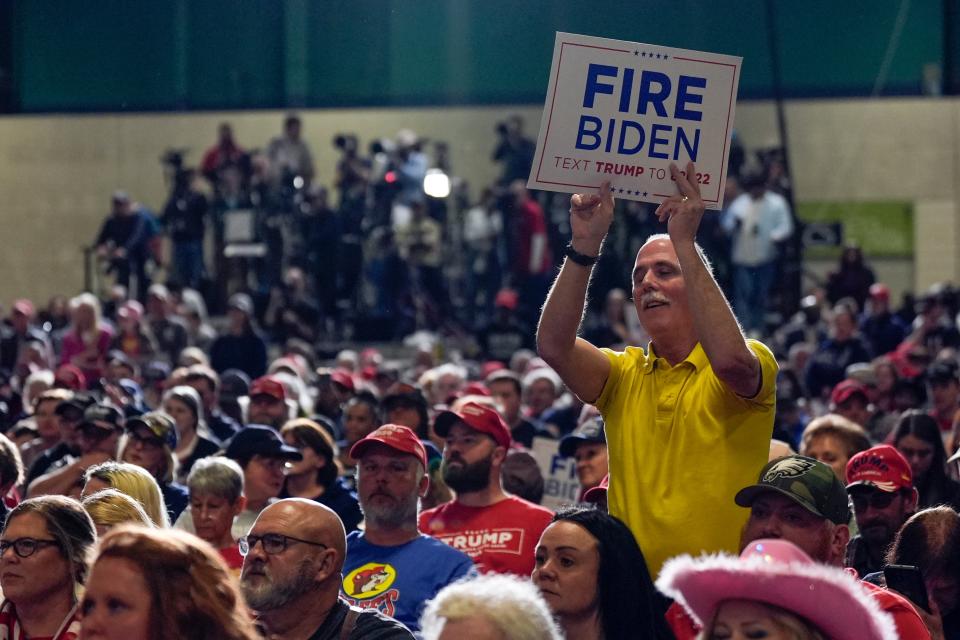 A supporter holds a sign as Republican presidential candidate former President Donald Trump speaks at a campaign rally Saturday, March 2, 2024, in Greensboro, N.C (AP)