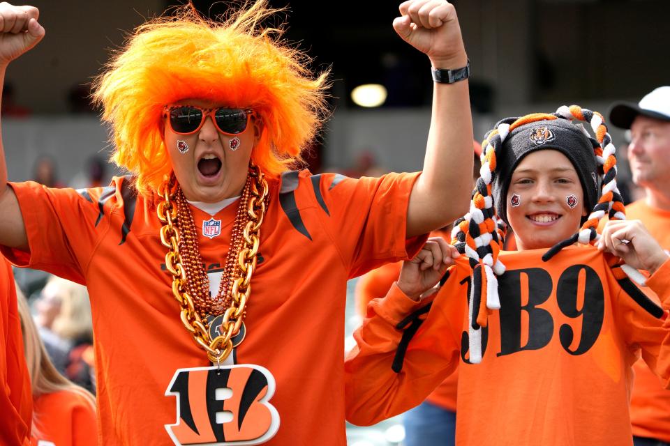 Caden Chu (left) and Dexter O'Malley (both 12) show their loyalty to the Cincinnati Bengals during warmups for NFL Week 1 at Paycor Stadium on Sunday, Sept. 8, 2024.