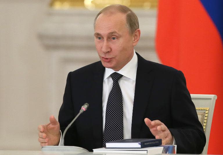 Russian President Vladimir Putin speaks during a meeting at the Kremlin in Moscow, December 24, 2014