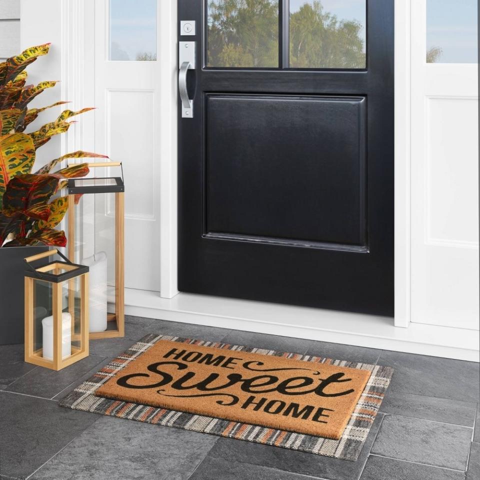 the door mat that reads home sweet home