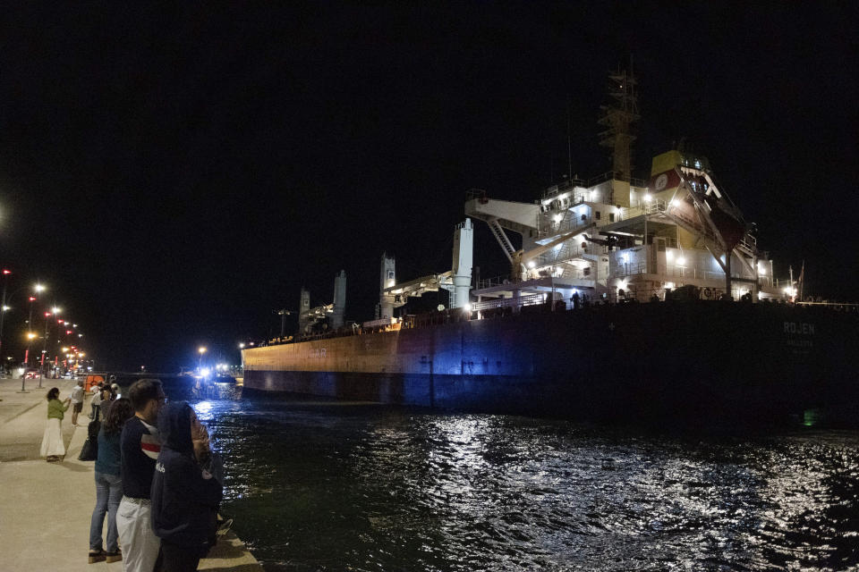 The cargo ship flying the Maltese flag Rojen, loaded with Ukrainian corn seeds, that left from Chornomorsk near Odessa, arrives into Ravenna port in Italy, Friday night, Aug. 12, 2022. (Guido Calamosca/LaPresse via AP)