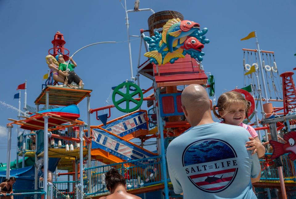 John Triantafyllou of Westfield holds his 2 year old daughter Reese as they visit Breakwater Beach. Crowds fill Breakwater Beach at Casino Pier in Seaside Heights, NJ In effort to beat the heat on June 29, 2021. 