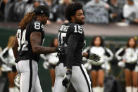 <p>Michael Crabtree #15 of the Oakland Raiders is walked off the field by Cordarrelle Patterson #84 after being ejected for fighting with Aqib Talib #21 of the Denver Broncos during their NFL game at Oakland-Alameda County Coliseum on November 26, 2017 in Oakland, California. (Photo by Robert Reiners/Getty Images) </p>