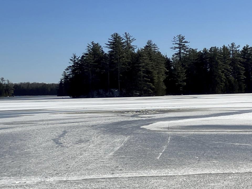 This photo provided by the Maine Warden Service shows broken ice on a lake in the Maine wilderness where a man crashed into the icy water and drowned, Friday, Dec. 8, 2023, in T3 Indian Township Purchase, Maine. (Maine Warden Service via AP)