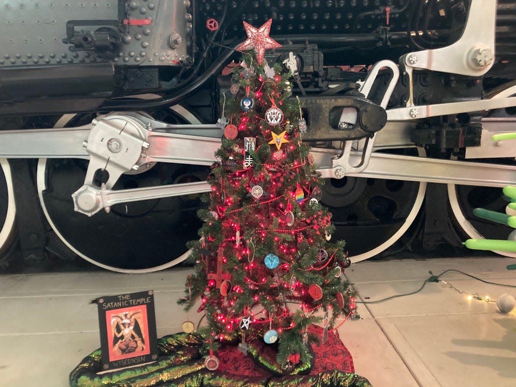 The Satanic Temple of Wisconsin joined this year's Festival of Trees at the National Railroad Museum in Ashwaubenon. Although its name may shock some visitors, the organization says it represents peace, equality, empathy and an end to tyrannical thinking and injustice.