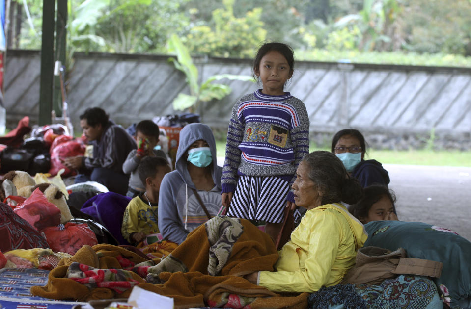 <p>Villagers rest at an evacuee camp in Rendang, Bali, Indonesia, Monday, Sept. 25, 2017. More than 35,000 people have fled a menacing volcano on the Indonesia tourist island of Bali, fearing will erupt for the first time in more than half a century as increasing tremors rattle the region. (AP Photo/Firdia Lisnawati) </p>