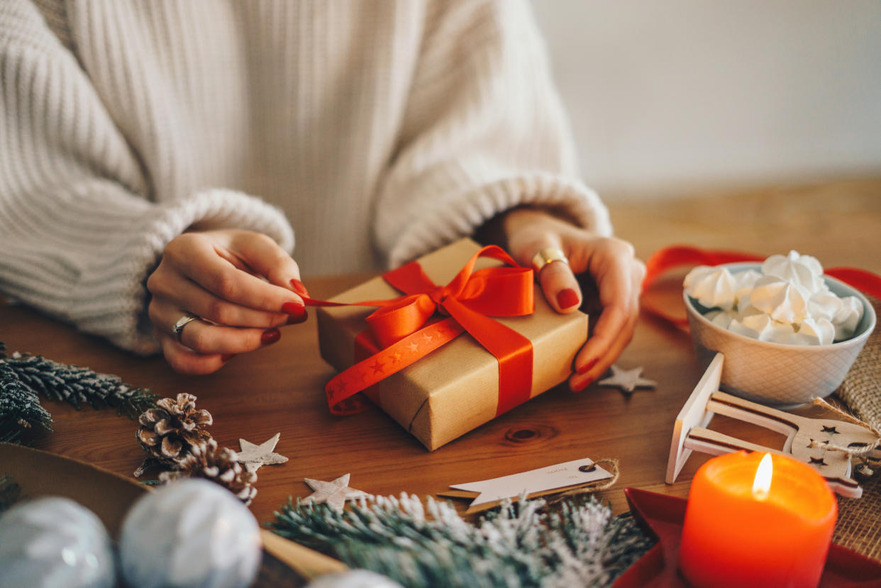 Woman wrapping Christmas gifts