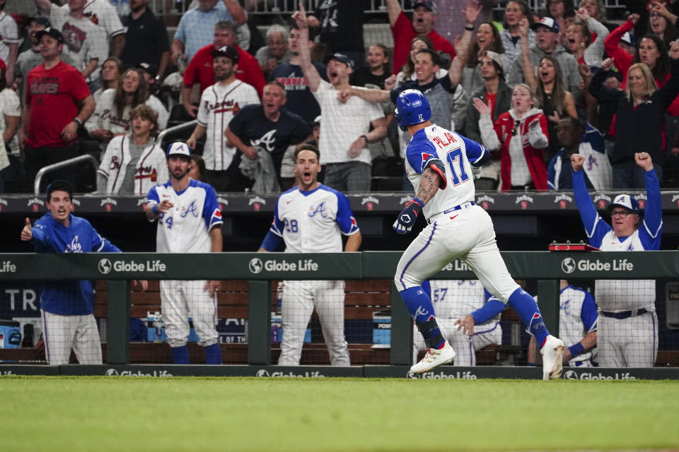 Atlanta Braves players reacts as pinch hitter Kevin Pillar (17) runs the bases after hitting a two-run home run in the eighth inning of a baseball game against the Baltimore Orioles, Saturday, May 6, 2023, in Atlanta. (AP Photo/John Bazemore)