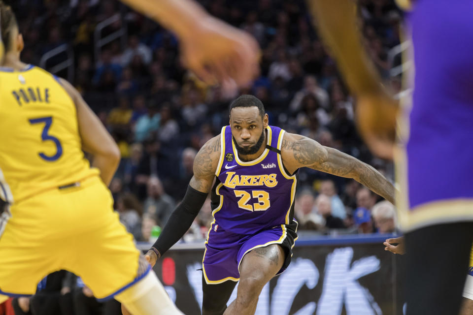 Los Angeles Lakers forward LeBron James (23) dribbles against the Golden State Warriors in the first half of an NBA basketball game in San Francisco Saturday, Feb. 8, 2020. (AP Photo/John Hefti)