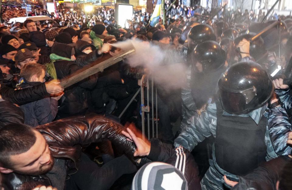 <b>Nov. 30:</b> Police brutally attack a group of protesters, detaining 35. Images of protesters bloodied by police truncheons spread quickly and galvanize public support for the demonstrations. A protest on Dec. 1 attracts around 300,000 people, the largest in Kyiv since the Orange Revolution in 2004. Activists seize Kyiv City Hall.