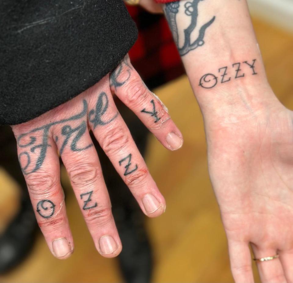 The knuckles of Brian Fallon of the Gaslight Anthem and he wrist of Emily Wolf after Bryan Kienlen of the Bouncing Souls tattooed "Ozzy" on them at his Anchors Aweigh Tattoo studio in Bradley Beach on Jan. 28, 2024.