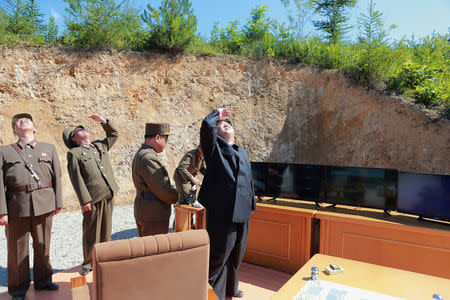 North Korean leader Kim Jong Un looks on during the test-launch of the intercontinental ballistic missile Hwasong-14. KCNA/via REUTERS